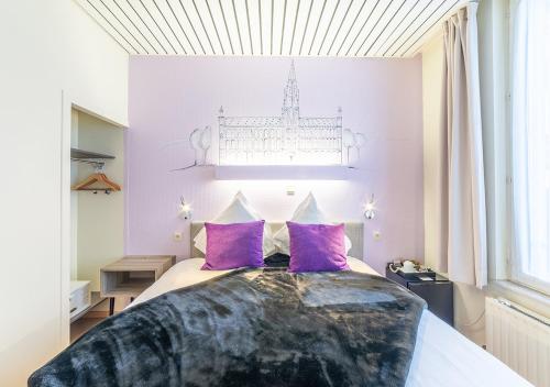 Ένα ή περισσότερα κρεβάτια σε δωμάτιο στο Hotel La Legende
