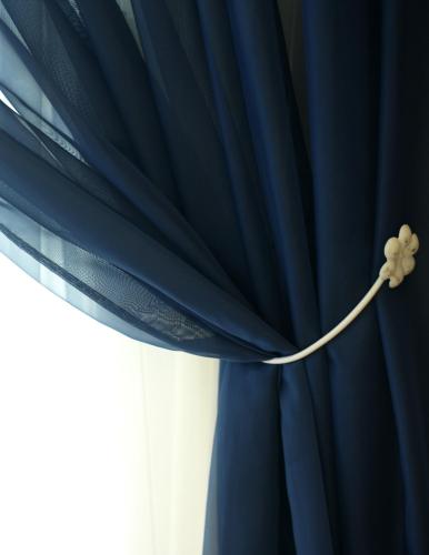 a blue curtain with a flower on it at Hotel Feldberg in Riccione