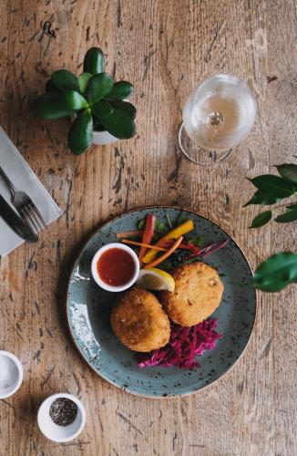 a plate of food on a wooden table at Dukes Inn in Sidmouth