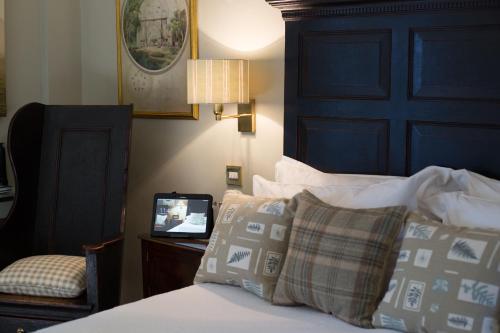 a bedroom with a bed and a tv on a table at Luxury Escape in Hunstanton