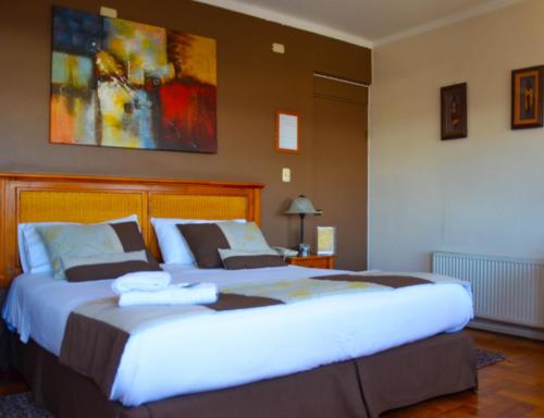Ένα ή περισσότερα κρεβάτια σε δωμάτιο στο Hotel Dikran