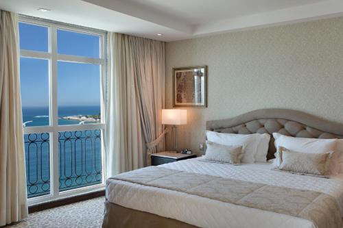 Кровать или кровати в номере Miramar By Windsor Copacabana