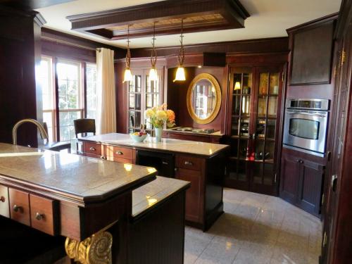a kitchen with wooden cabinets and a counter top at Stone Garden Inn in Trenton