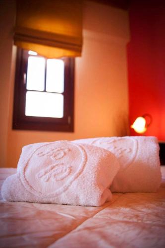 Postel nebo postele na pokoji v ubytování Hotel Kynaitha