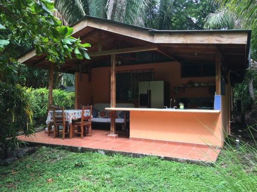 a kitchen and dining area of a house at Mal Pais Surf Camp in Santa Teresa Beach