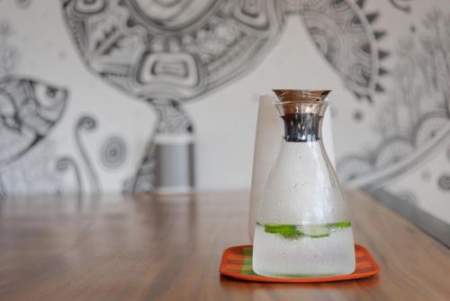 a bottle of milk sitting on a table at Hikka Hill Loft in Hikkaduwa
