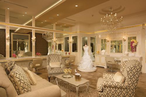 a wedding dress is hanging in a living room at Secrets Vallarta Bay Resort & SPA - Adults Only in Puerto Vallarta