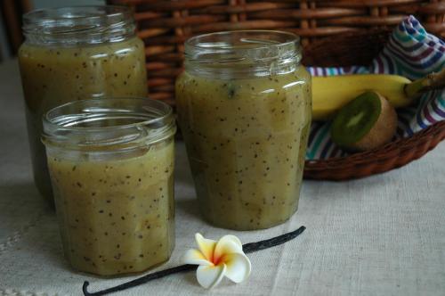 three jars of green chia pudding next to a basket of fruit at Chambres d'Hotes Belard in Plonévez-Porzay