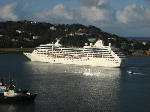 a cruise ship is docked in the water at Bayside Villa St. Lucia in Castries