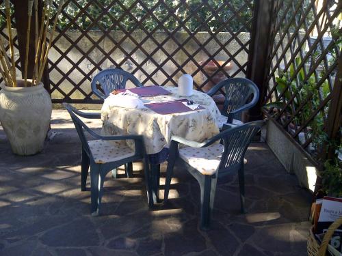 a table and chairs sitting on a patio at B&B A Casa di Mael in San Costanzo