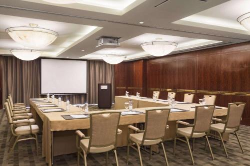 a conference room with a long table and chairs at Crowne Plaza - Dubai Jumeirah by IHG in Dubai
