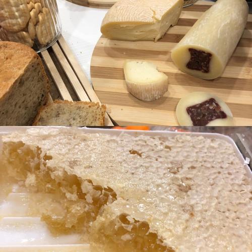 a bunch of different types of bread on a cutting board at Boutique Hotel Palazzo Corso Umberto in Boiano