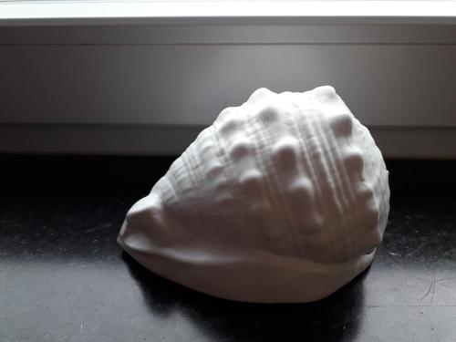 a large white rock sitting on the floor at Gästehaus Strandkonsulat in Scharbeutz