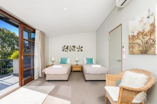 a living room with a couch and a table at Byron Bay Accom Unit 2 21-25 Fletcher Street - Casablanca at Bogarts in Byron Bay
