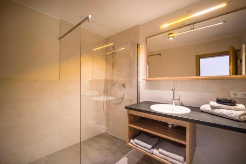 a bathroom with a sink and a shower at Apartment Gerlos 183 in Gerlos