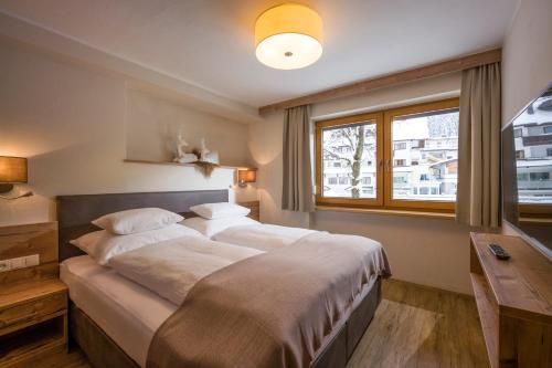 Postel nebo postele na pokoji v ubytování Apartment Gerlos 183