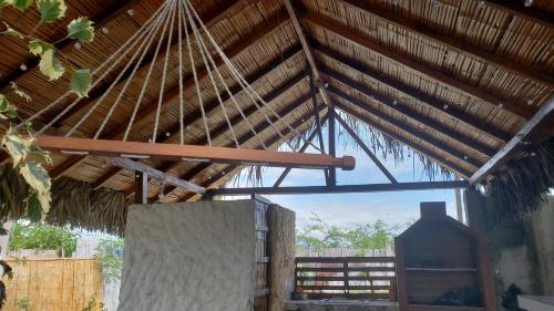 a roof of a building with a large window at Hugo's Relax Home (Casa) in Ayangue