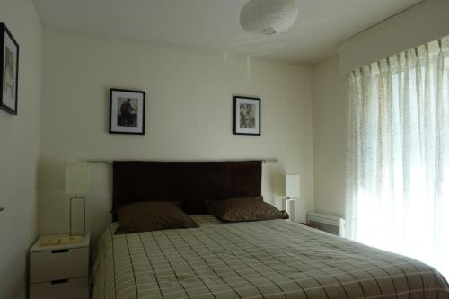 En eller flere senge i et værelse på Eden Beach