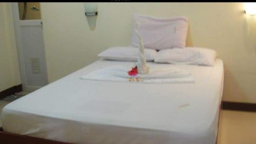 Postelja oz. postelje v sobi nastanitve AJ Travellers Inn - Main