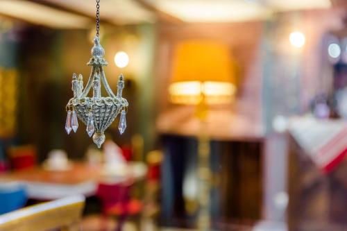 a chandelier hanging from the ceiling in a room at Tiflis Inn Boutique Hotel in Tbilisi City
