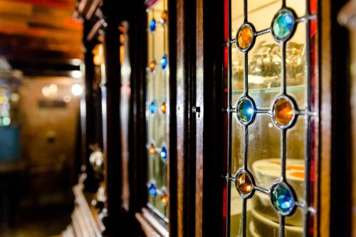 a group of stained glass windows on a door at Tiflis Inn Boutique Hotel in Tbilisi City