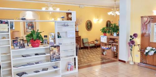 a store with shelves of shoes in a room at Albergo Natucci in Montecatini Terme