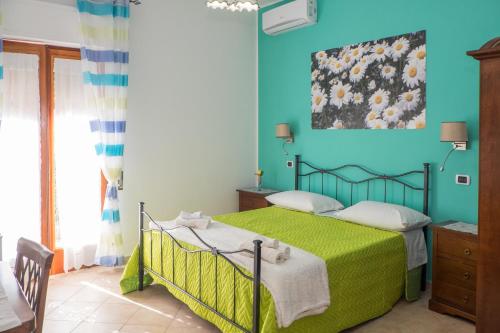 Postel nebo postele na pokoji v ubytování Vivere a colori