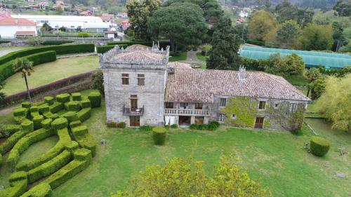an aerial view of a house with a garden at Pazo da Touza in Nigrán