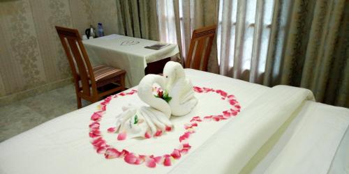 Postel nebo postele na pokoji v ubytování Noahgarden Hotel