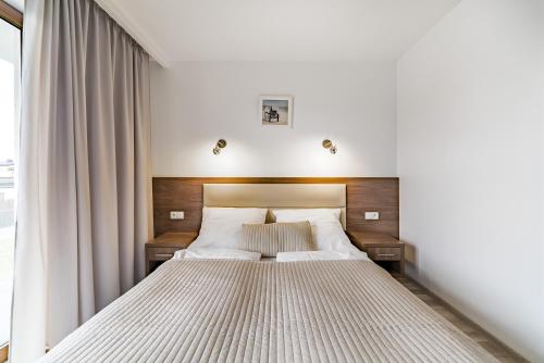 Postel nebo postele na pokoji v ubytování Apartamenty i Pokoje Gościnne Relax