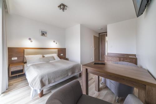 Postel nebo postele na pokoji v ubytování Apartamenty i Pokoje Gościnne Relax