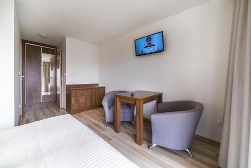 TV a/nebo společenská místnost v ubytování Apartamenty i Pokoje Gościnne Relax