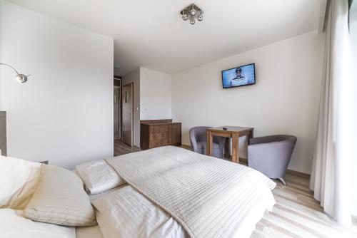 Postel nebo postele na pokoji v ubytování Apartamenty i Pokoje Gościnne Relax