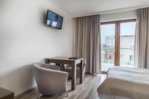 Postel nebo postele na pokoji v ubytování Apartamenty i Pokoje Gościnne Relax