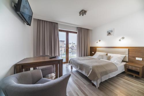 Postel nebo postele na pokoji v ubytování Apartamenty i Pokoje Gościnne Relax