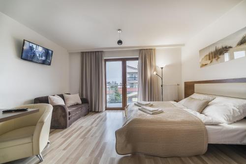 TV a/nebo společenská místnost v ubytování Apartamenty i Pokoje Gościnne Relax