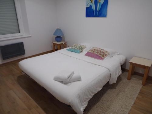 a bedroom with a white bed with a tray on it at Domaine de Bel Air in Cérans-Foulletourte