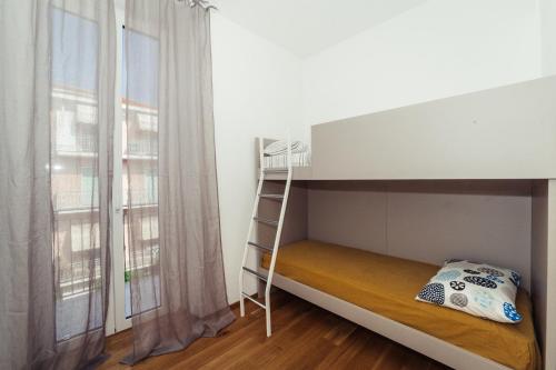 Ένα ή περισσότερα κρεβάτια σε δωμάτιο στο Home Diano Marina
