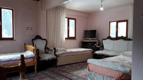 Säng eller sängar i ett rum på Yesilyayla Eko Turizm