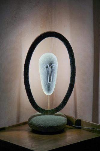 a sculpture of a bird with its face in a mirror at Residenza Fra Le Torri - Charme & Art Gallery Home in Arezzo