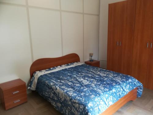 Katil atau katil-katil dalam bilik di confortevole appartamento in centro con terrazza vista mare