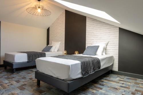 Ein Bett oder Betten in einem Zimmer der Unterkunft Maison de centre ville