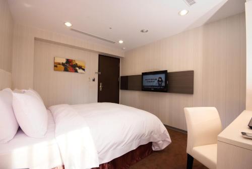 TV a/nebo společenská místnost v ubytování Hotel Leisure 台中輕行旅