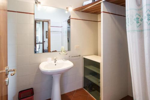 a bathroom with a sink and a mirror at Independent loft on Florence's hills in Fiesole