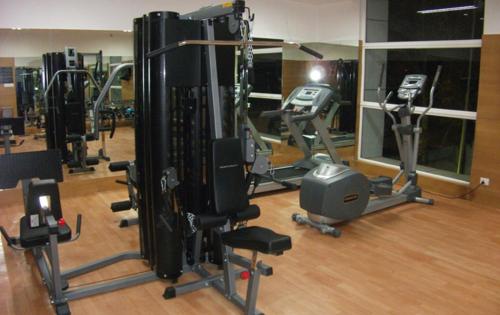 a room with a lot of equipment on the floor at Goldfinch Retreat Bangalore in Devanhalli