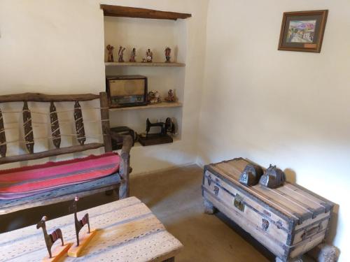 a room with two oldunks and a tv in it at Sendero De Las Cabras in Purmamarca