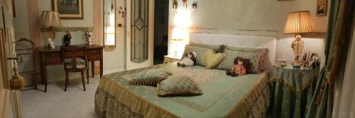 a bedroom with a bed with pillows on it at Luxury B&B IL Sogno in Cerignola