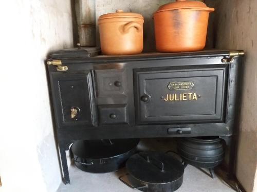 an old stove with pots on top of it at Sendero De Las Cabras in Purmamarca