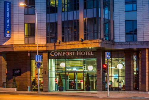 a store front of a hotel on a city street at Comfort Hotel LT - Rock 'n' Roll Vilnius in Vilnius