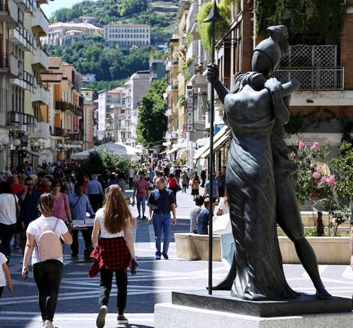 a statue of a woman on a city street at Le Sculture B&B in Cosenza